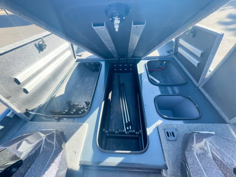 Slide: The Image of 2023 Ranger RT198P boat storage compartments open under bright sunlight. - 21