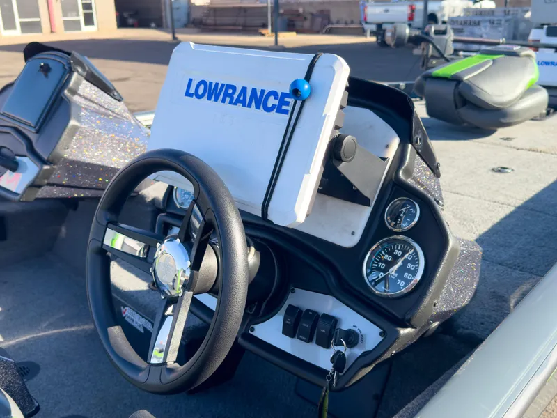 Slide: The Image of 2023 Ranger RT198P boat dashboard with Lowrance GPS and steering wheel. - 23