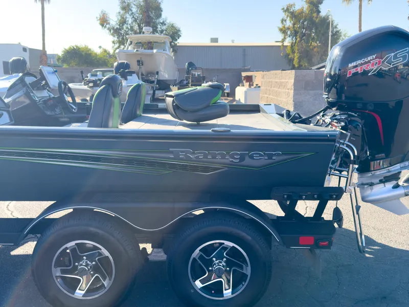Slide: The Image of 2023 Ranger RT198P boat with Mercury Pro XS engine, parked outdoors. - 24