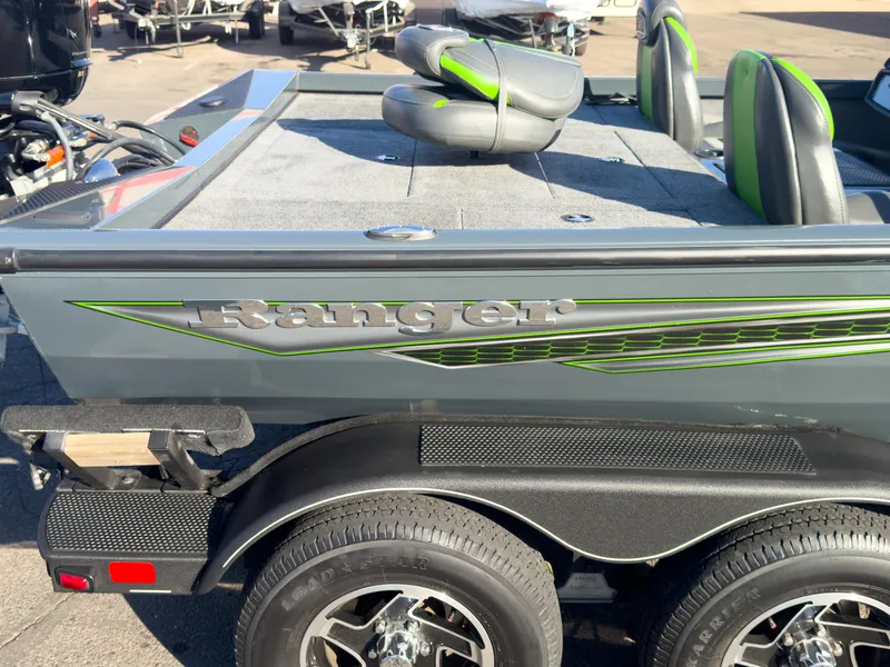 Slide: The Image of 2023 Ranger RT198P boat with sleek design and green accents. - 5