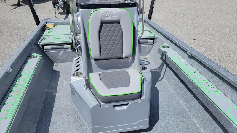 Slide: The Image of 2025 Xpress H24 Bay boat interior with Yamaha Vmax 250 SHO, featuring sleek seating and measuring guides. - 13