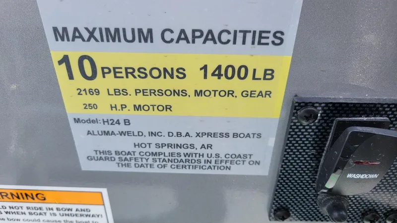 Slide: The Image of Xpress H24 Bay boat capacity label, 10 persons, 1400 lbs, 250 HP motor, 2025 model. - 17