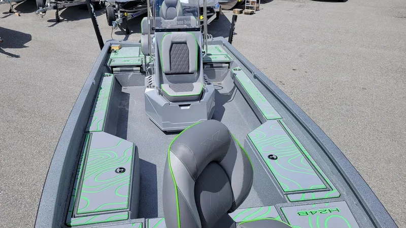 Slide: The Image of 2025 Xpress H24 Bay boat interior with Yamaha Vmax 250 SHO, featuring sleek seating and storage. - 20