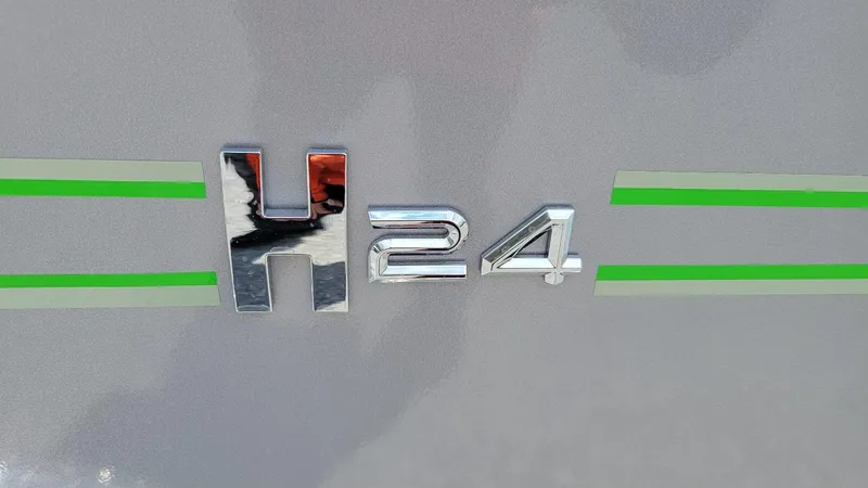 Slide: The Image of 2025 Xpress H24 Bay emblem with green stripes, featuring Yamaha Vmax 250 SHO. - 3