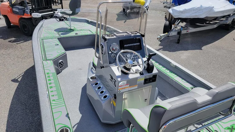 Slide: The Image of 2025 Xpress H24 Bay boat with Yamaha Vmax 250 SHO, featuring advanced navigation controls. - 7