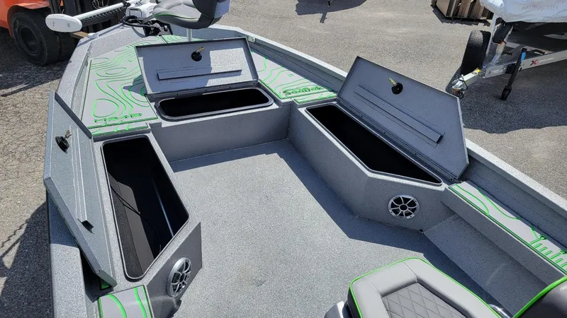 Slide: The Image of 2025 Xpress H24 Bay boat interior with storage compartments and seating. - 9