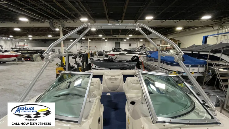 Slide: The Image of 2000 Sea Ray 210 BR boat in showroom with wakeboard tower, Marine Center Indiana. - 13