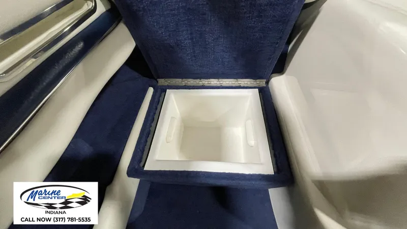 Slide: The Image of Interior storage compartment of a 2000 Sea Ray 210 BR boat. - 16