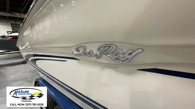 Slide: The Image of 2000 Sea Ray 210 BR boat with logo, displayed at Marine Center Indiana. - 17