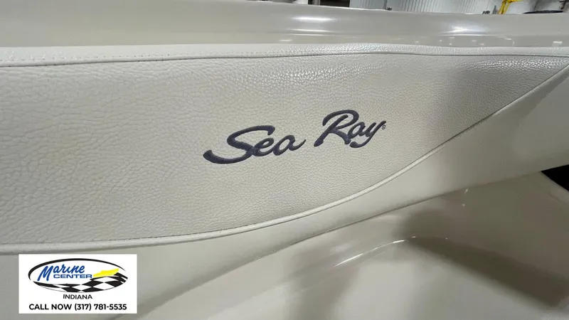Slide: The Image of Sea Ray 210 BR 2000 boat interior with logo, Marine Center Indiana contact info. - 18