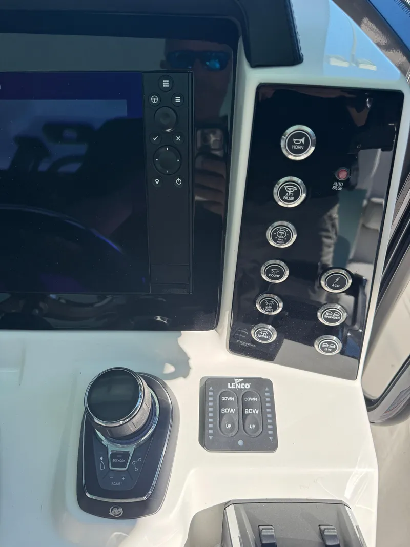 Slide: The Image of 2024 Robalo R302 Center Console dashboard with controls and display. - 20