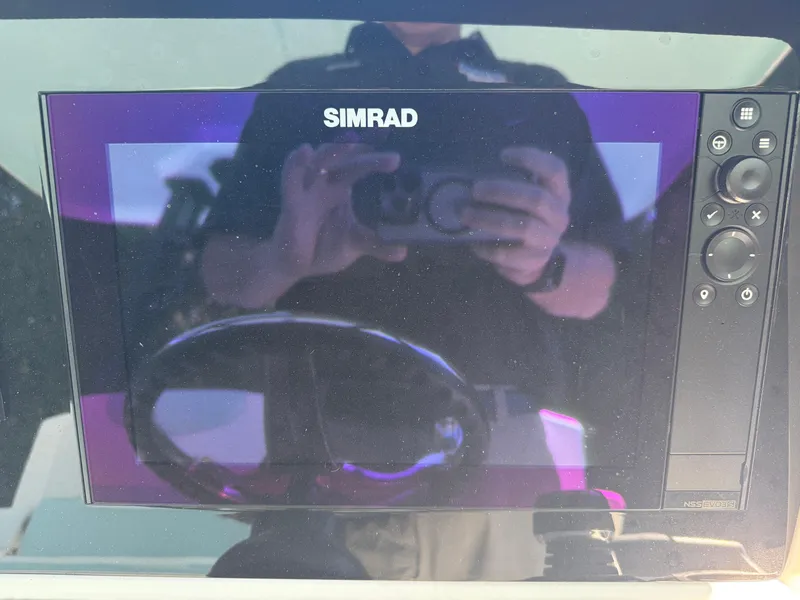 Slide: The Image of Simrad display on 2024 Robalo R302 Center Console boat dashboard. - 22