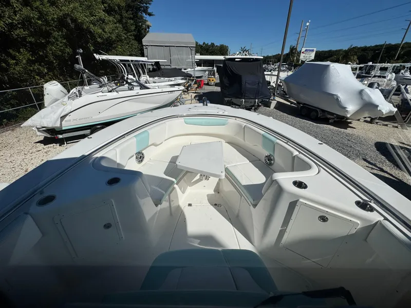 Slide: The Image of 2024 Robalo R302 Center Console boat, spacious deck, parked in marina. - 27