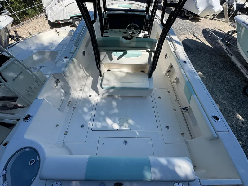 Slide: The Image of 2024 Robalo R302 Center Console boat interior with spacious seating and modern helm. - 4