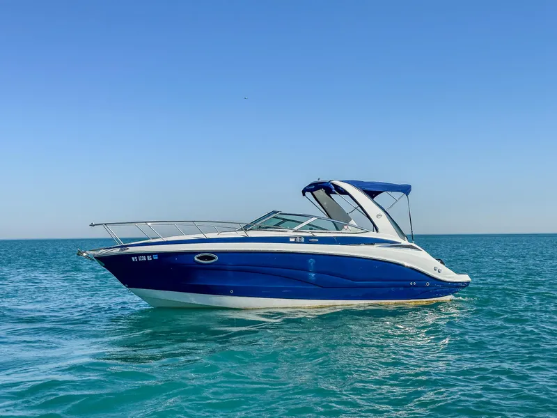 Slide: The Image of 2020 Crownline 264 CR boat on calm blue ocean waters. - 4