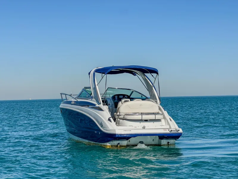 Slide: The Image of 2020 Crownline 264 CR boat cruising on clear blue water. - 7