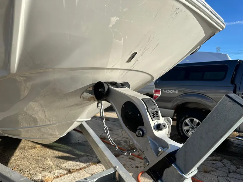 Slide: The Image of 2020 Crownline E235XS boat on trailer, close-up of bow and hitch. - 3