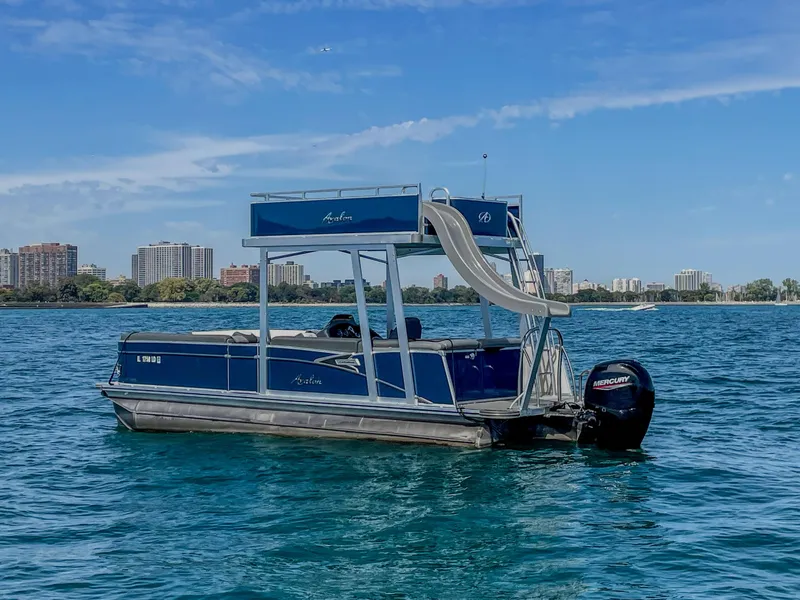 Slide: The Image of 2022 Avalon Catalina FunShip pontoon boat with slide on a sunny day. - 1