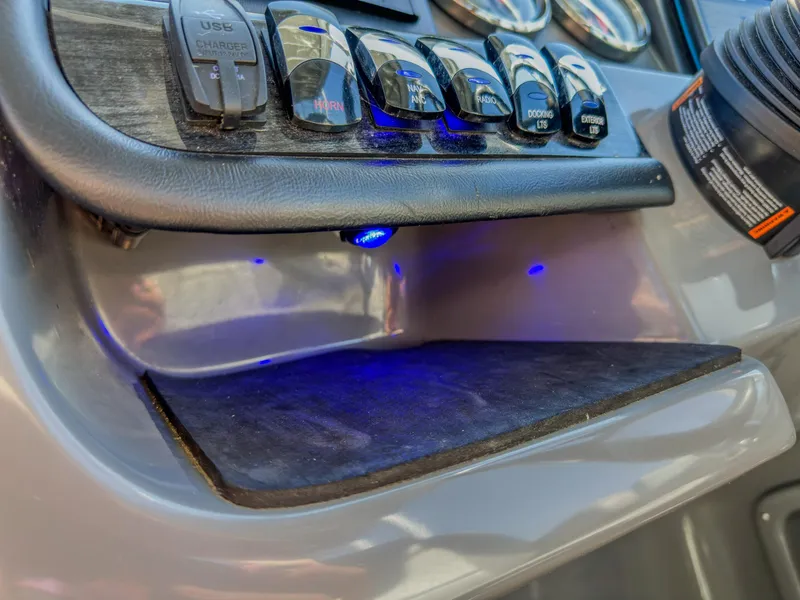 Slide: The Image of Control panel of 2022 Avalon Catalina FunShip with illuminated switches and USB port. - 16