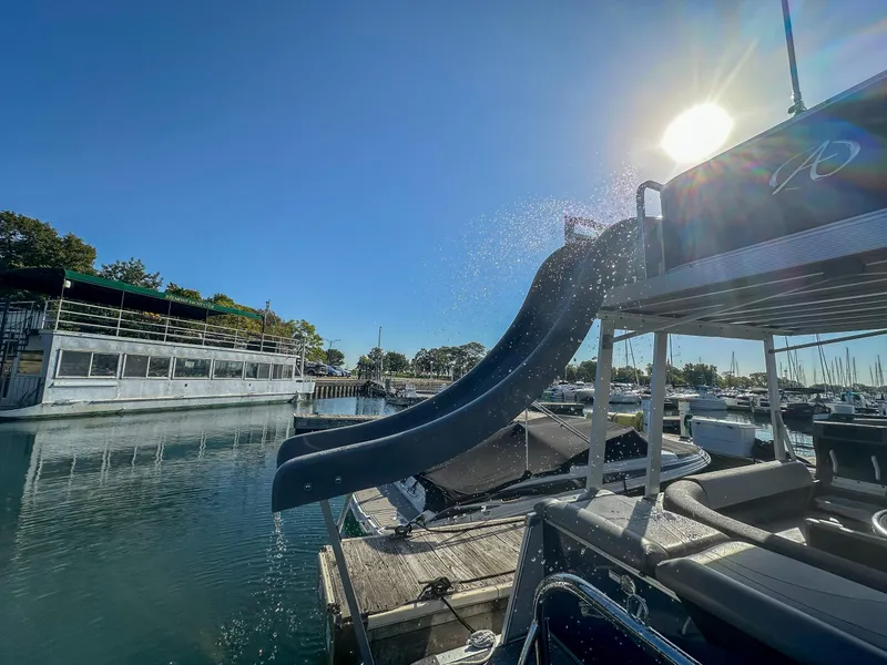 Slide: The Image of Avalon Catalina FunShip 2022 with waterslide, docked under sunny sky. - 17