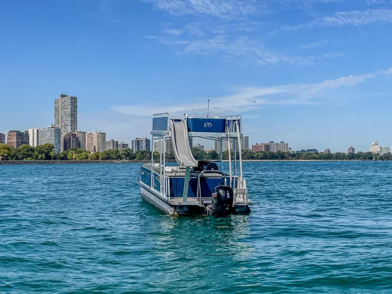 Slide: The Image of 2022 Avalon Catalina FunShip pontoon boat with slide on a city lake. - 2