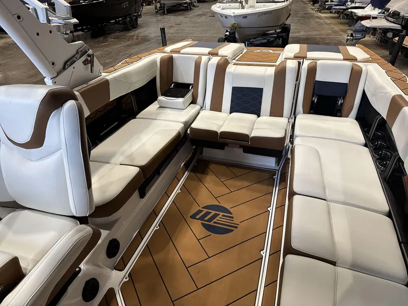 Slide: The Image of 2024 Malibu 23LSV boat interior with luxurious seating and stylish design. - 13