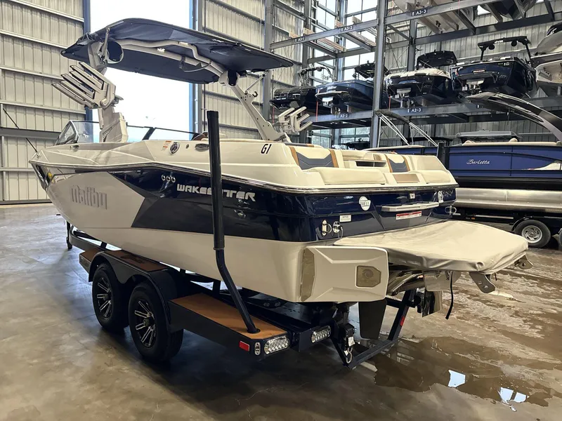 Slide: The Image of 2024 Malibu 23LSV Wakesetter boat in storage facility, rear view. - 4