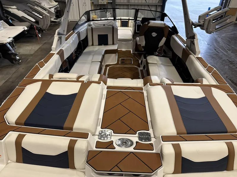 Slide: The Image of 2024 Malibu 23LSV boat interior with luxurious seating and modern design. - 7