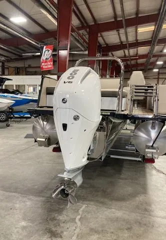 Slide: The Image of 2025 Avalon 23 Catalina Versatile Rear Bench boat with powerful V8 engine in showroom. - 2