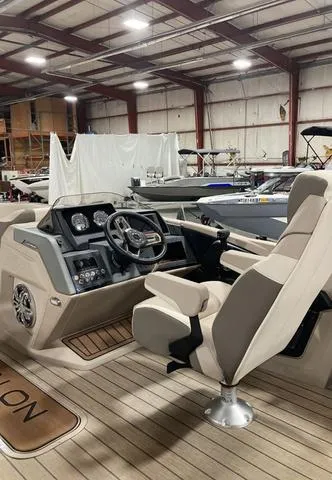 Slide: The Image of 2025 Avalon 23 Catalina Versatile Rear Bench boat interior in a showroom. - 3