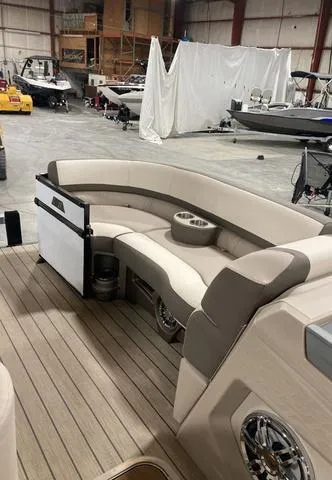 Slide: The Image of 2025 Avalon 23 Catalina Versatile Rear Bench in a showroom, featuring luxurious seating and modern design. - 5