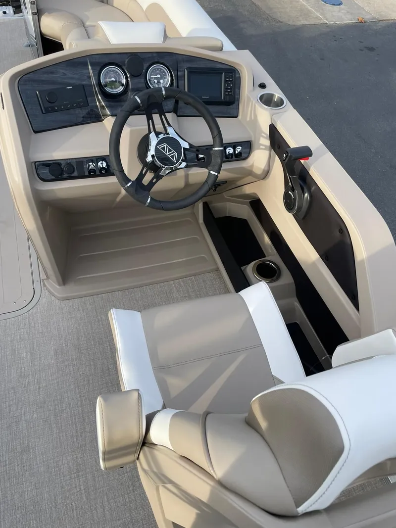 Slide: The Image of 2025 Avalon LSZ Cruise Rear Bench boat interior with modern dashboard and steering wheel. - 13