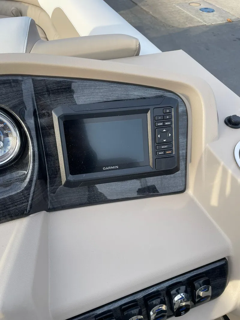 Slide: The Image of 2025 Avalon LSZ Cruise dashboard with Garmin display and controls. - 14