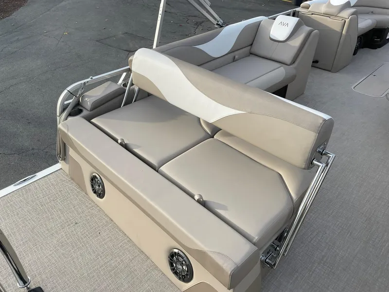 Slide: The Image of 2025 Avalon LSZ Cruise Rear Bench with beige seating and integrated speakers. - 21