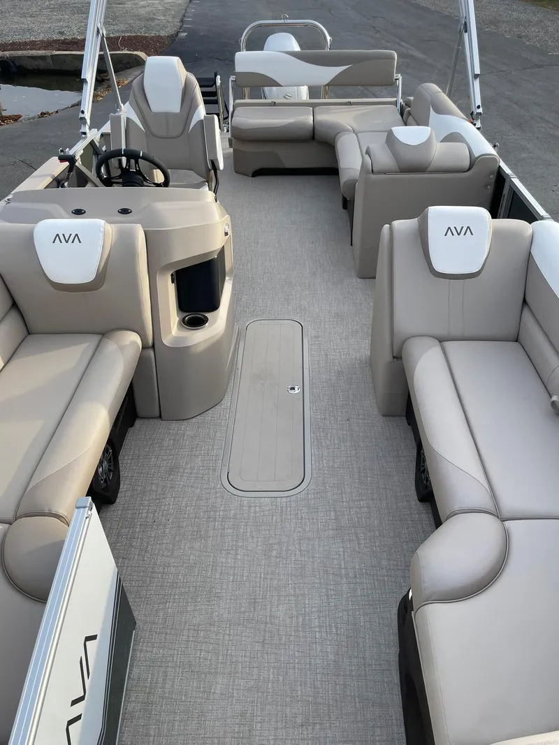 Slide: The Image of 2025 Avalon LSZ Cruise Rear Bench pontoon boat with spacious seating and modern design. - 9
