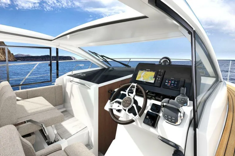 Slide: The Image of 2025 Sealine C335V yacht cockpit with modern navigation system and plush seating. - 8
