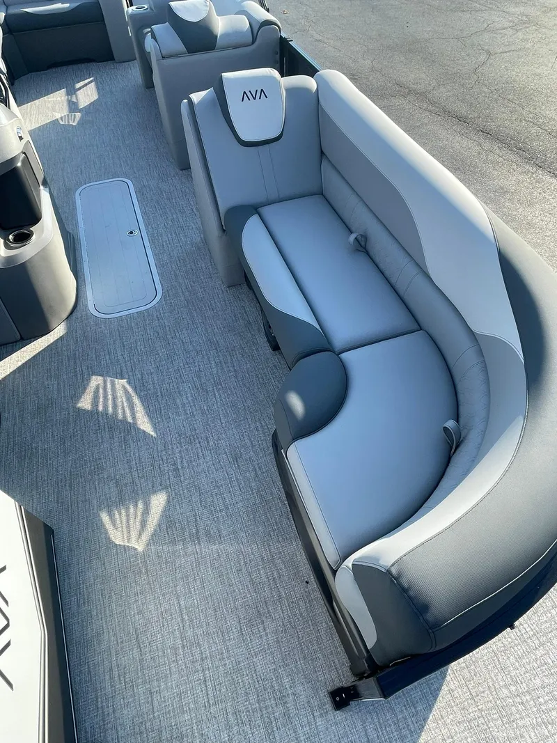 Slide: The Image of 2025 Avalon LSZ ELITE boat interior with plush gray seating and modern design. - 12