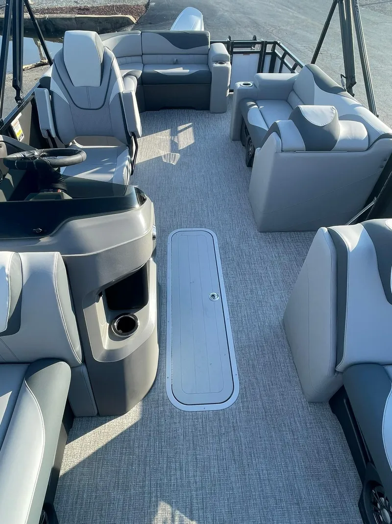 Slide: The Image of 2025 Avalon LSZ ELITE pontoon boat interior with modern seating and sleek design. - 13
