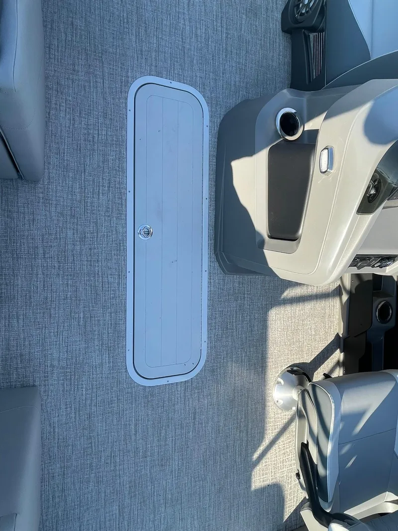 Slide: The Image of 2025 Avalon LSZ ELITE boat interior with gray flooring and seating. - 14