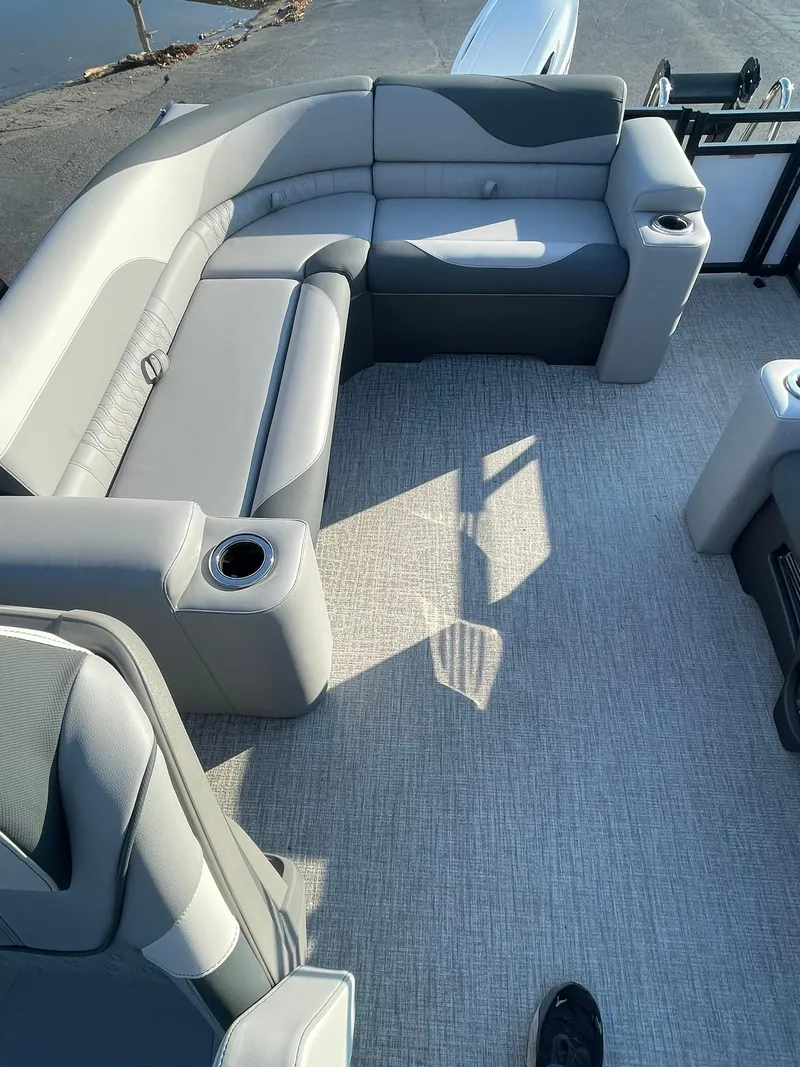 Slide: The Image of 2025 Avalon LSZ ELITE boat interior with gray seating and carpet flooring. - 17