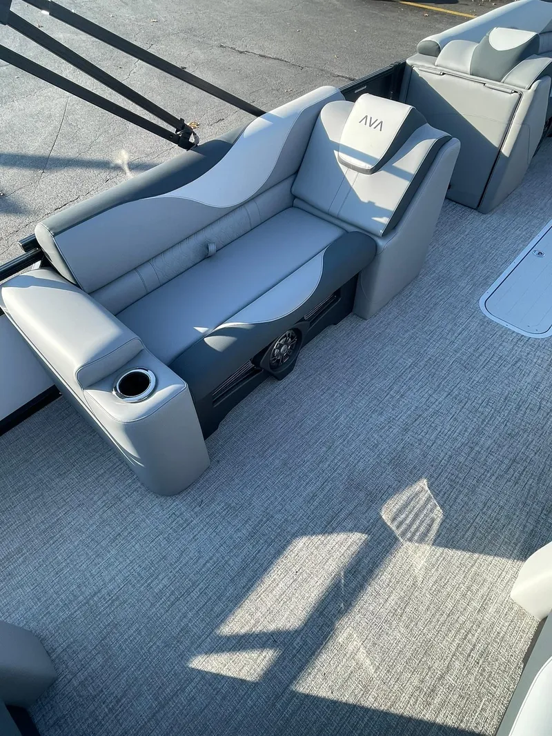 Slide: The Image of 2025 Avalon LSZ ELITE boat interior with gray seating and carpet flooring. - 18