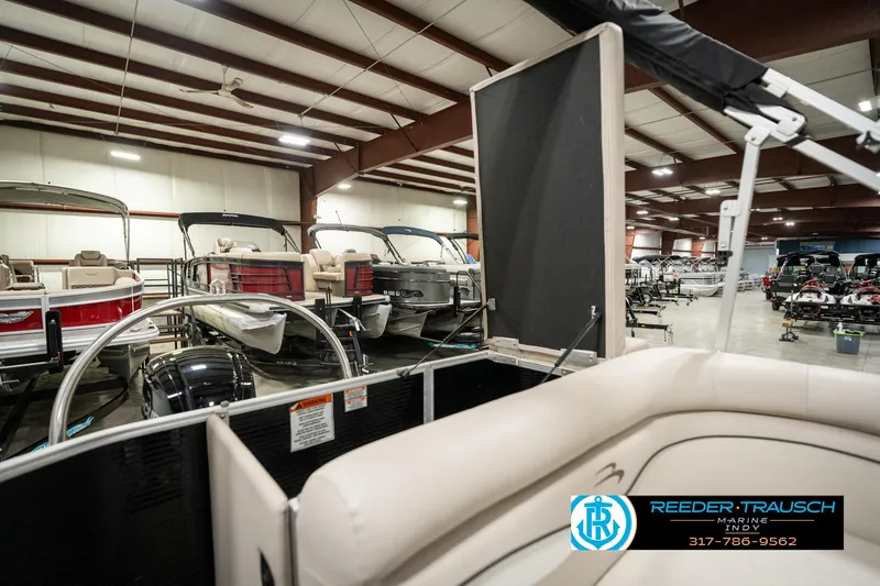 Slide: The Image of 2019 Bennington 21 SLX pontoon boat in indoor showroom, Reeder-Trausch Marine. - 27