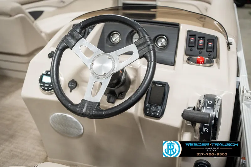 Slide: The Image of 2019 Bennington 21 SLX boat dashboard with steering wheel and controls. - 28