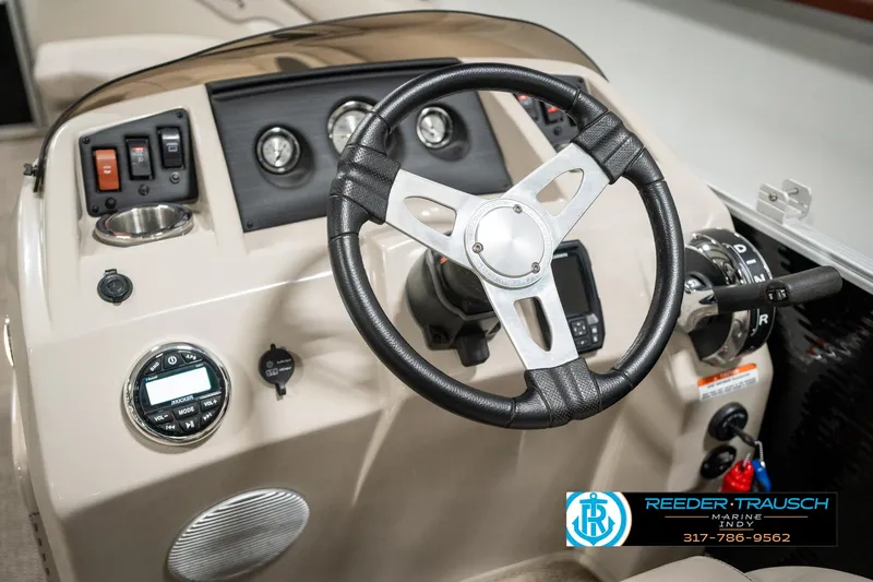 Slide: The Image of 2019 Bennington 21 SLX boat dashboard with steering wheel and controls. - 29
