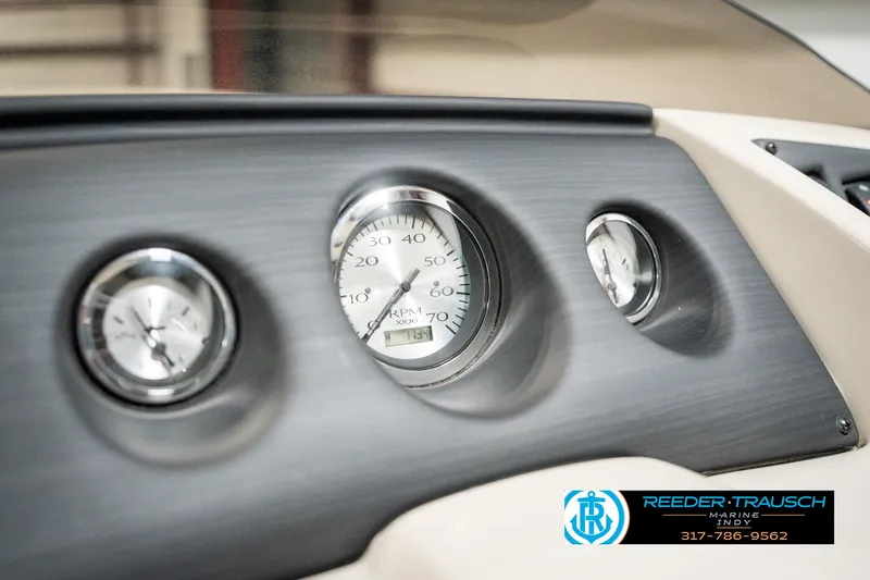 Slide: The Image of Dashboard of 2019 Bennington 21 SLX boat with gauges and logo. - 33