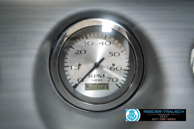 Slide: The Image of Close-up of 2019 Bennington 21 SLX RPM gauge, displaying 1134 hours. - 34