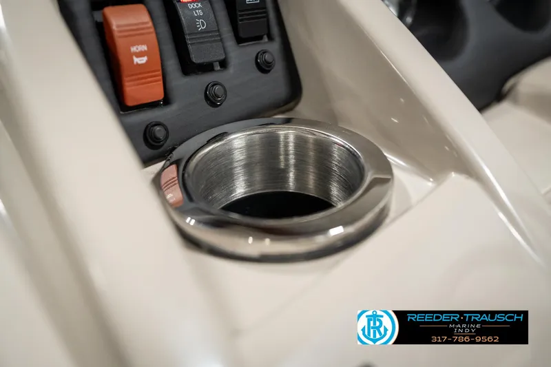Slide: The Image of Bennington 21 SLX 2019 boat console with cup holder and control switches. - 43