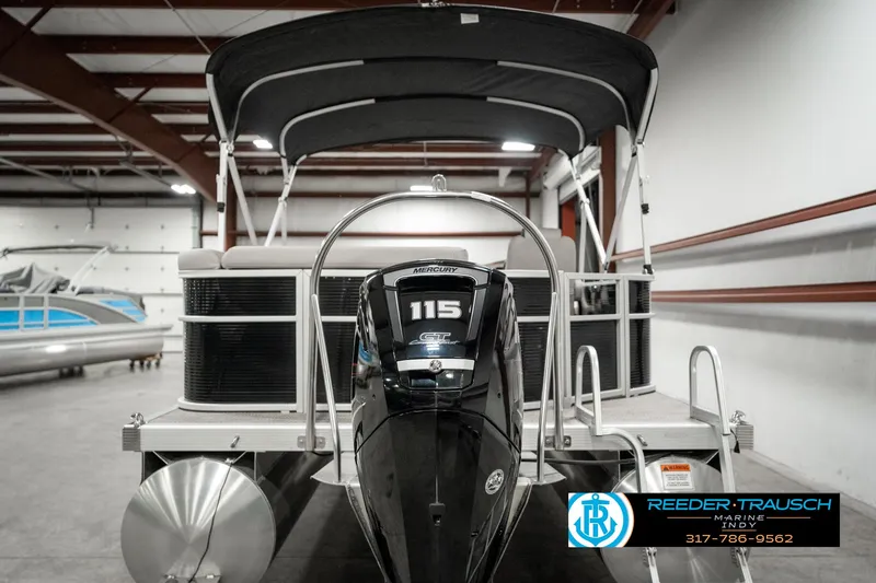 Slide: The Image of 2019 Bennington 21 SLX pontoon boat with 115 HP engine in indoor showroom. - 7