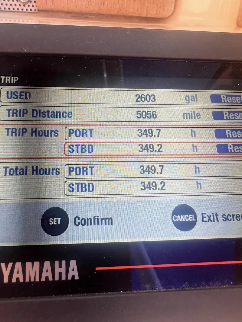 Slide: The Image of Yamaha boat display showing trip data: 2603 gallons used, 5056 miles traveled, 349.7 hours. - 15