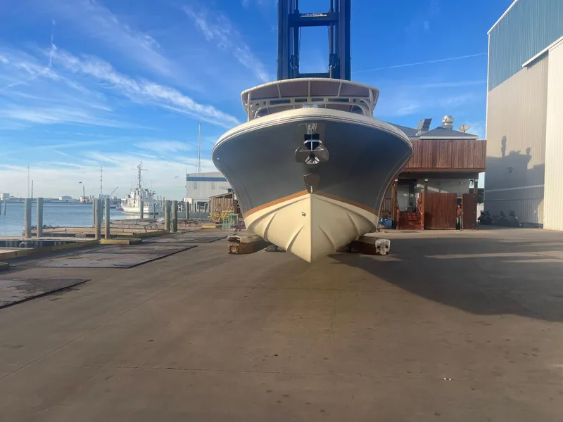 Slide: The Image of 2017 Chris-Craft Calypso boat on dock with clear blue sky. - 3